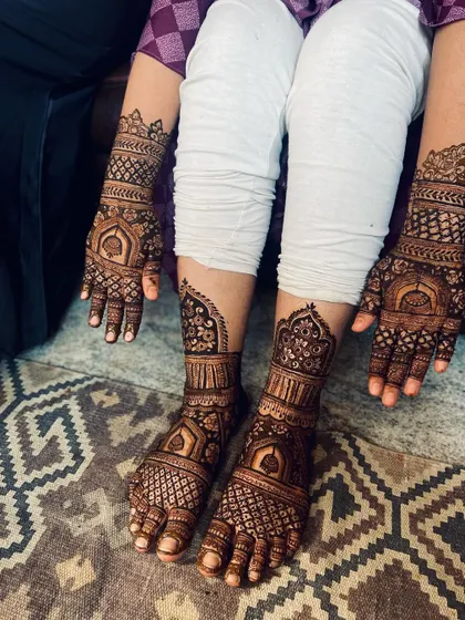 A complete bridal mehendi set, with matching intricate designs for both hands and feet. This shows the full coverage I offer, extending up the forearms and mid-calf, creating a cohesive and stunning look for your wedding day.