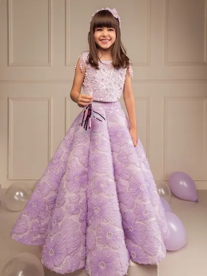 This lilac lehenga features unique 3D floral textures on the skirt, making it a standout piece for any celebration.