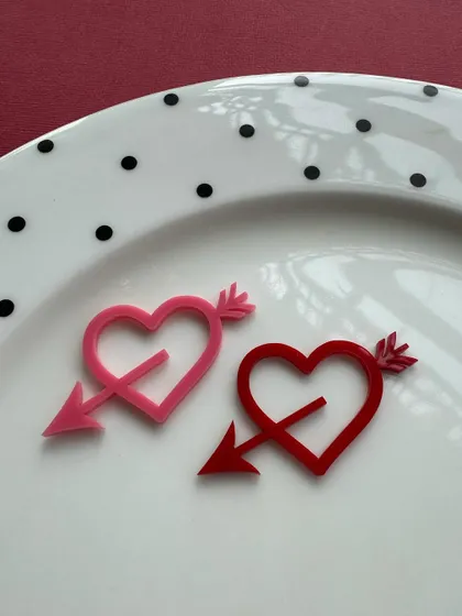 Simple and sweet heart-and-arrow charms in pink and red acrylic. These are great for decorating cupcakes or adding a small touch to a larger cake.