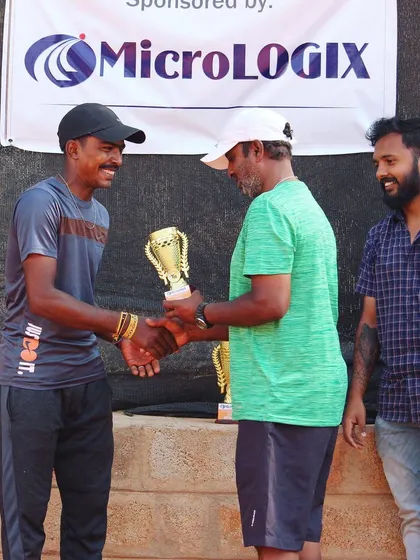 The runner-up, Raju M, is presented with his award. Every final is a testament to the hard work and skill of the players who reach it.