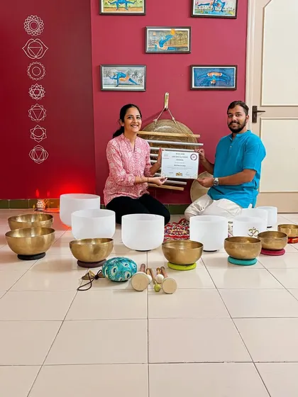 Presenting a certificate to a graduate of the March 2024 course. This moment celebrates her dedication and marks the start of her journey sharing the healing essence of sound.