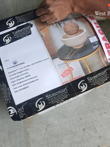 The final packed box for a small tabletop fountain, securely taped with my branded tape and ready for dispatch to West Bengal.