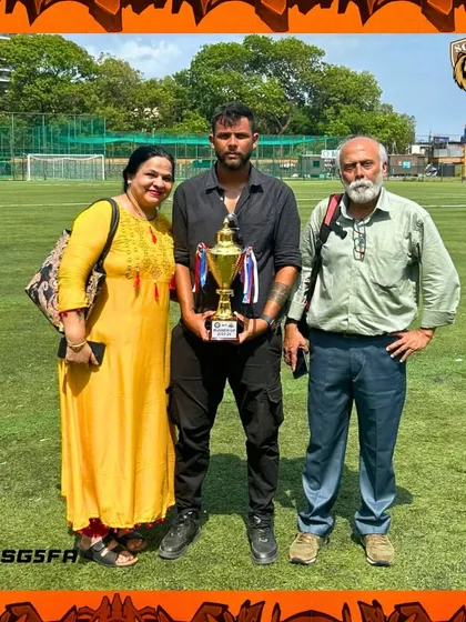 Our founder with his parents, celebrating the team's achievement. The support of family is the backbone of our academy's success.