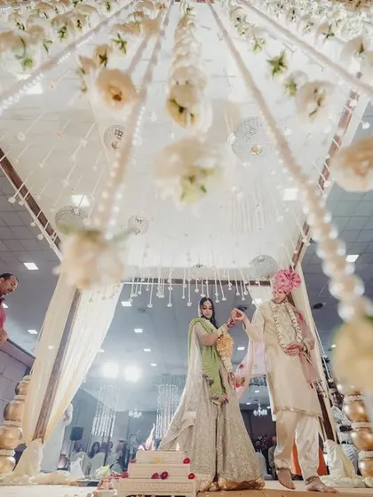 A duplicate of 282, capturing the ethereal quality of the hanging floral decor within the mandap.