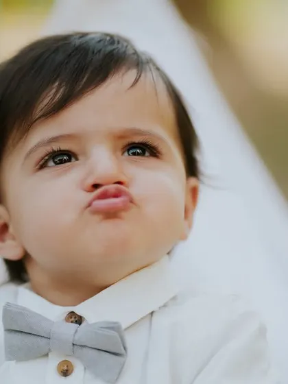A classic baby pout. This expressive close-up is full of personality and is a fun addition to his gallery.