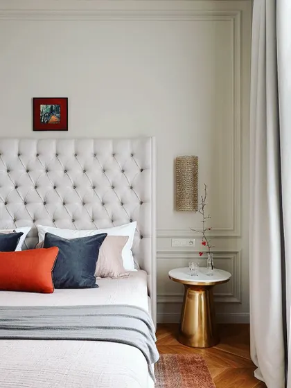 Headboards with wall mouldings are a perfect combination for your bedroom. This design features a classic button-tufted headboard against a wall with simple, elegant trim work.
