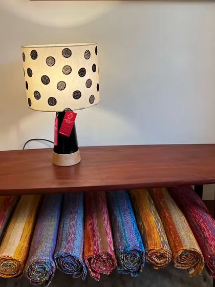 This image from our partner Ethico shows our lamp with a black Channapatna base and a polka-dotted lampshade. It's a great example of how our lighting pieces can be styled in different settings.