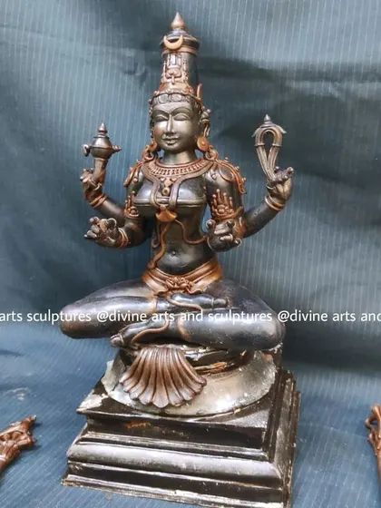 A work-in-progress wax model of Goddess Kamakshi. Even in this unfinished state, her serene expression and the symbolic sugarcane bow and parrot are beginning to take shape.