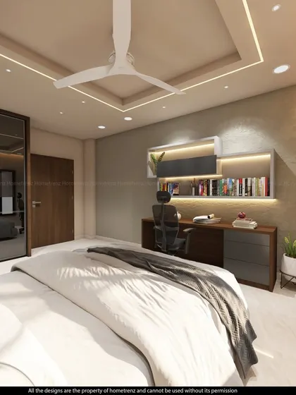 This bedroom features a floating desk and overhead shelves, creating a functional workspace. The large mirrored wardrobe enhances the sense of space and light.