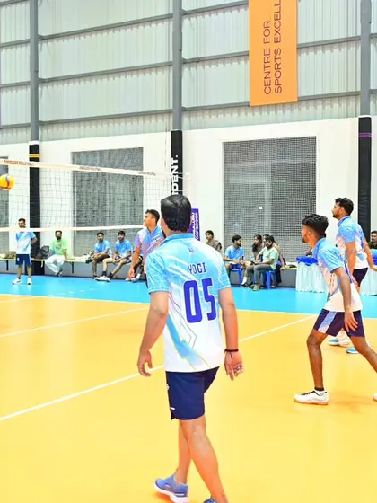 In position and ready to play during a corporate tournament on an indoor court.