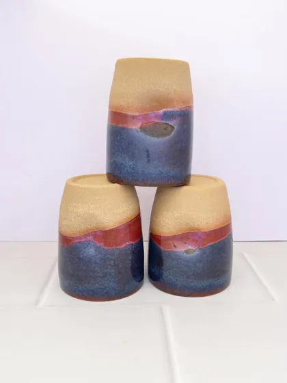 A set of three Celestial Dunes grip mugs, each with its own unique pattern.