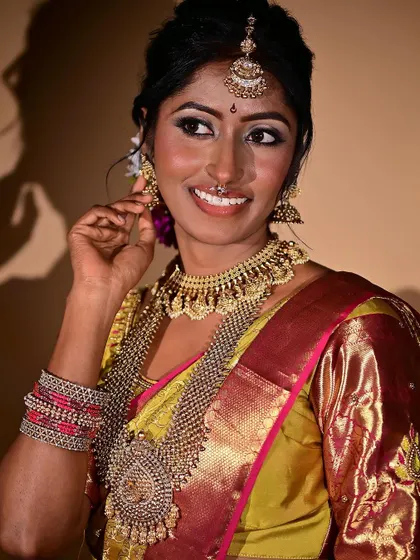 A close-up on the bride's happy expression. The makeup enhances her features without masking them, allowing her natural beauty to shine through, which is my ultimate goal for every client.