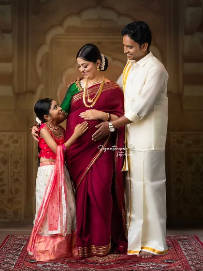 Awaiting the new arrival with love. This elegant, traditionally styled maternity portrait includes the whole family, celebrating the anticipation and the bond you already share.