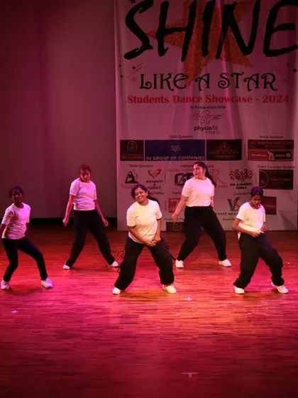 A group of students performing a fun, upbeat routine.