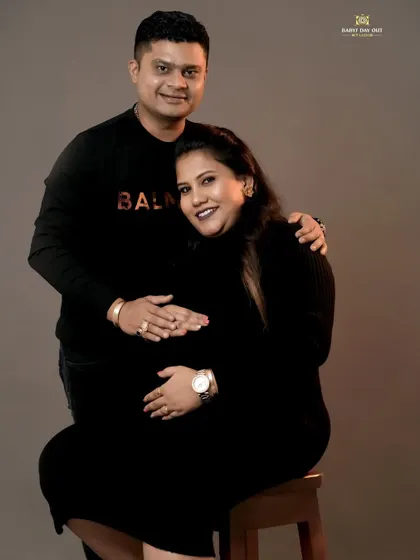 A classic and loving pose for an expecting couple in our studio. We focus on creating a comfortable atmosphere where you can relax and let your connection shine through.