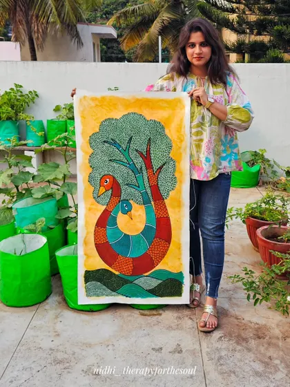 Here I am holding the finished 'Pair of Peacocks' painting, which helps to show its large, vertical scale. It's always a joy to see a piece completed before it heads off to its new home.