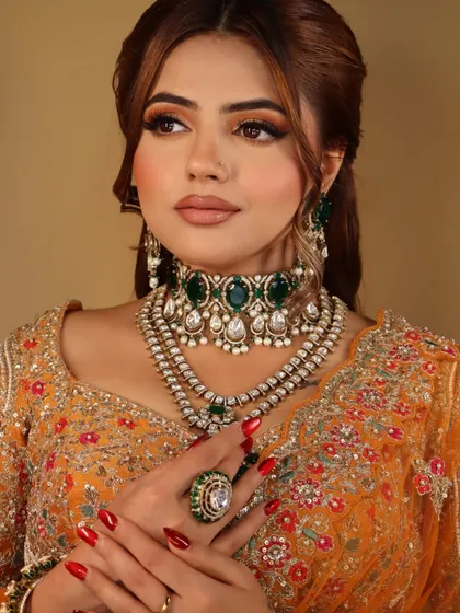 This shot focuses on the intricate jewellery and the perfectly manicured nails, showing my attention to every detail of the final look.