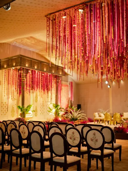 A view of the guest seating, with custom-embroidered chairs that echoed the floral motifs of the mandap design.