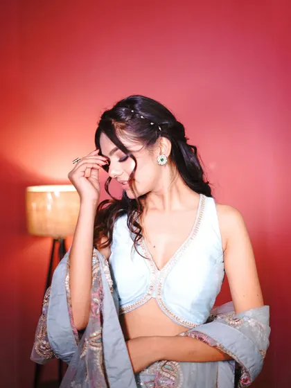 A close-up of the blue floral lehenga, highlighting the intricate embroidery.