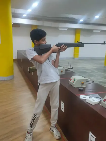 This young student demonstrates the standing shooting position he learned in our basic course. We focus on building a strong foundation for all our learners.