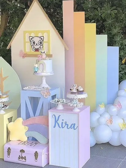 For those who love pastels, this setup is a dream. It features a pastel rainbow backdrop, a charming little house, and soft-colored props, creating a sweet and gentle aesthetic for a young child's birthday.