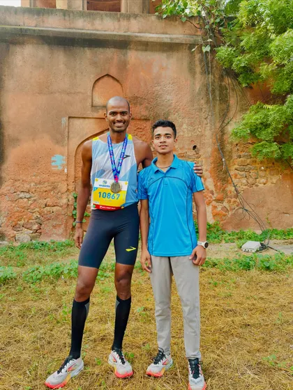 A post-race photo of two athletes. The camaraderie and mutual respect in the running community are truly special.