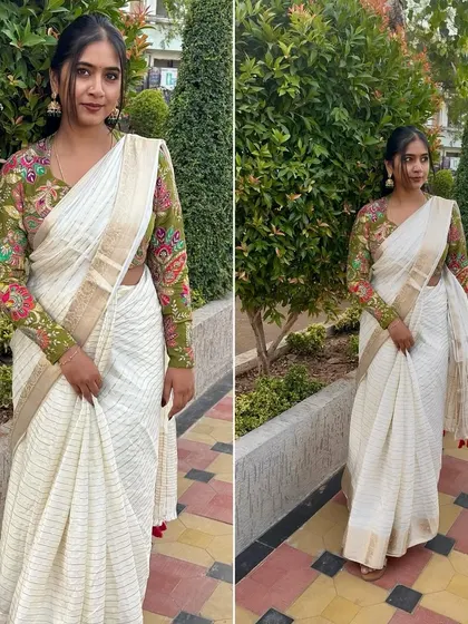 A full look at this beautiful off-white striped saree with a gold border. I've paired it with a contrast printed blouse to show how a simple saree can be elevated with the right blouse. It's a perfect mix of traditional and chic.