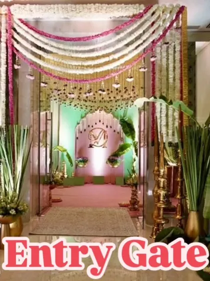 This elegant entry gate combines traditional and modern elements. I used heavy garlands of white and pink flowers, banana leaf signage, and a personalized monogram to create a welcoming and stylish entrance.