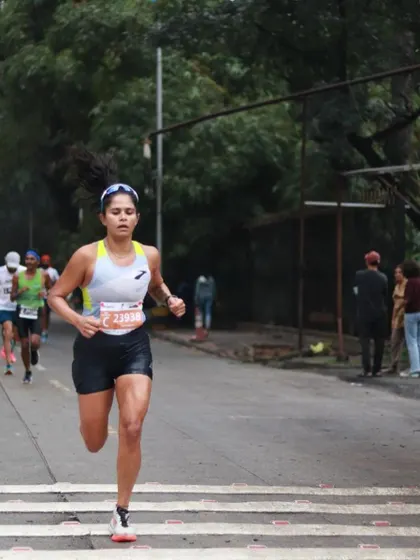 Running on a quiet, tree-lined section of the course. Even in a race, there are moments of calm. Training your mind to stay focused and present is just as important as training your body.