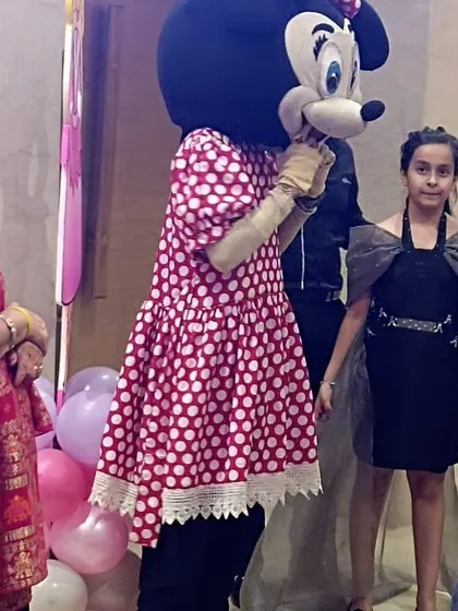 What's a party without a special guest? A Minnie Mouse mascot dropped by to surprise the kids and pose for photos, adding an extra layer of fun.
