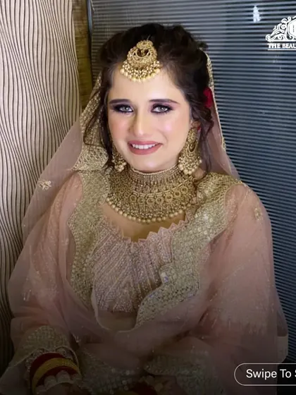 Another shot of this gorgeous client, smiling and confident. The makeup is perfectly balanced to complement her outfit and jewellery.