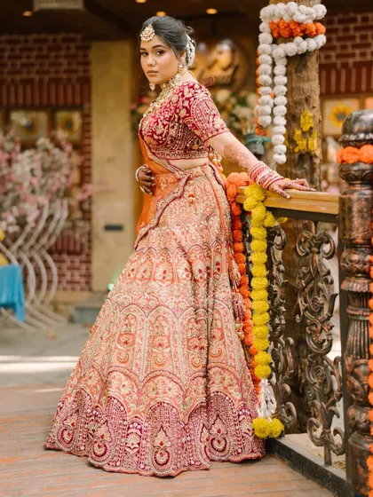 A full-length shot capturing the grandeur of a bridal lehenga. The makeup was crafted to be bold enough to stand out, yet elegant enough to feel timeless, ensuring the bride felt confident from her entrance to the final farewell.