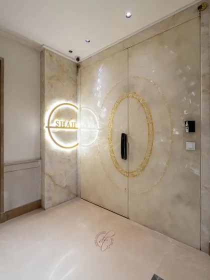 The entrance sets the tone for the entire home. This bespoke main door, crafted from luminous Selenite stone with mother of pearl inlays and a smart locking system, makes a powerful statement of refined luxury from the very first step.