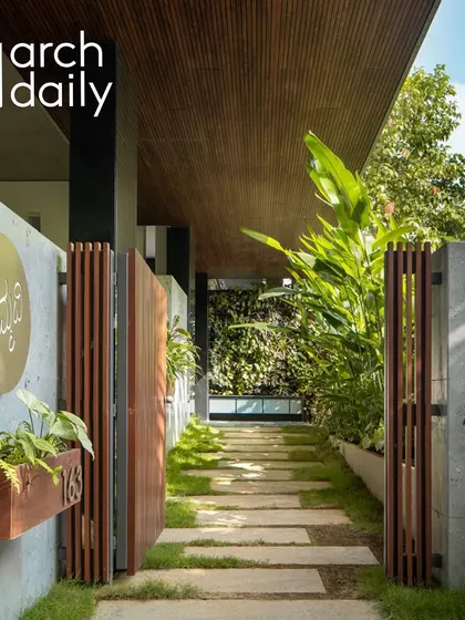 The entrance walkway is a gentle transition from the street to the home. Lined with stone pavers, lush plants, and a vertical green wall, it immediately immerses you in a natural, calming environment.