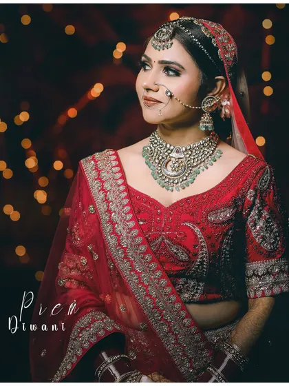 A beautiful bridal portrait with a "Piya Ki Diwani" theme. The bride looks stunning against a backdrop of festive lights.