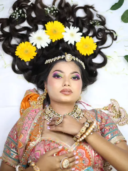 This shot shows a vibrant, multi-colored eye makeup look that is both artistic and wearable for a festive occasion.