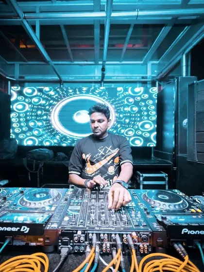 A duplicate wide shot of my DJ setup at a club.