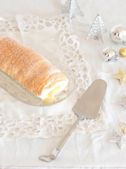 I love bringing treats from faraway places to you. This is a Brazo de Mercedes from the Philippines, a fluffy meringue roll with a sweet and tangy custard filling. It's luxuriously addictive!