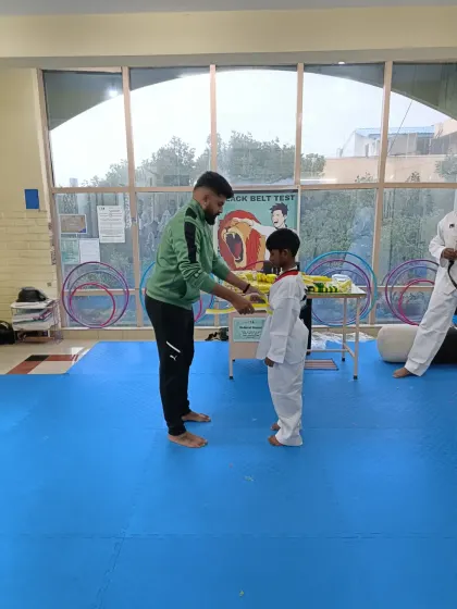 Tying a yellow belt.