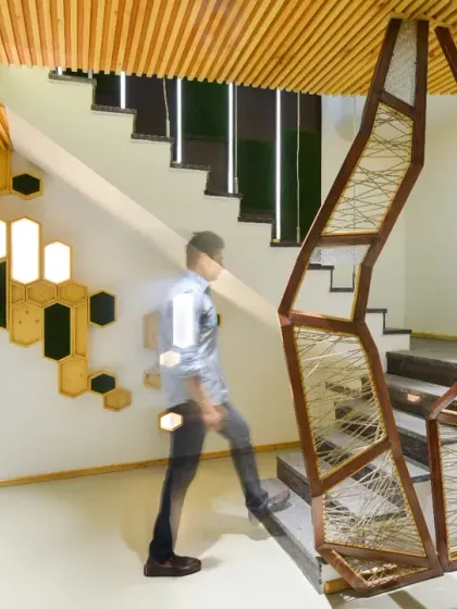 For the AMG Real Estate Office, I transformed a challenging basement space into a dramatic, modern lobby. The design uses an open-plan layout and a striking staircase to create a sense of openness and aesthetic harmony, setting a sophisticated tone from the moment of entry.