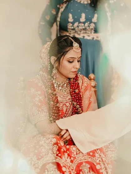 A soft-focus, artistic shot of the bride during her wedding ceremony, creating a dreamy and ethereal mood.