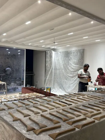 Our craftsmen preparing the individual wooden elements for the 3D wall panel in the 'ARAH' project. It's a bold concept that required meticulous execution.