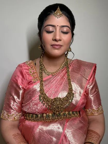 A close-up of Shruthi's eye makeup. The soft, shimmery tones and defined liner create a beautiful and elegant look.