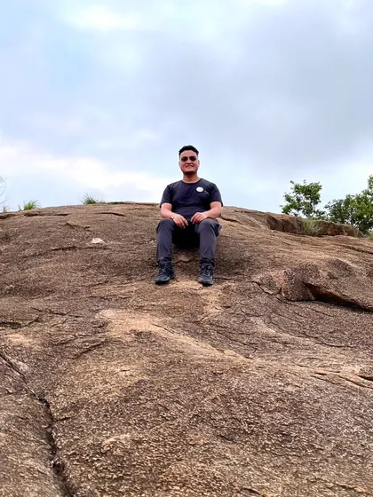 Resting on the unique rock formations of Makalidurga. The terrain itself is a key part of the adventure.