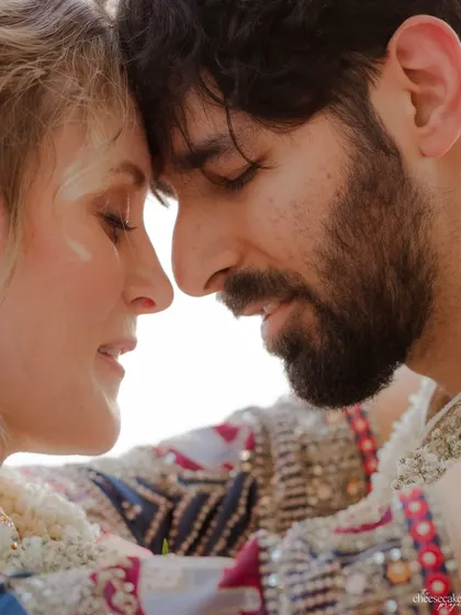 An extreme close-up, capturing the quiet intimacy and connection between the couple.