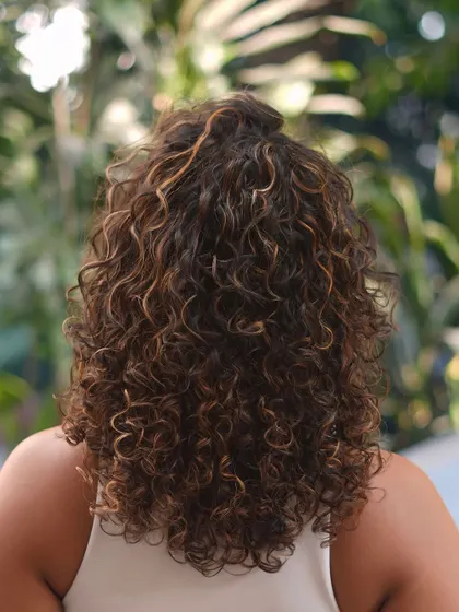 The back view of these wonderous waves, showing the beautiful distribution of color and the healthy bounce of the curls.