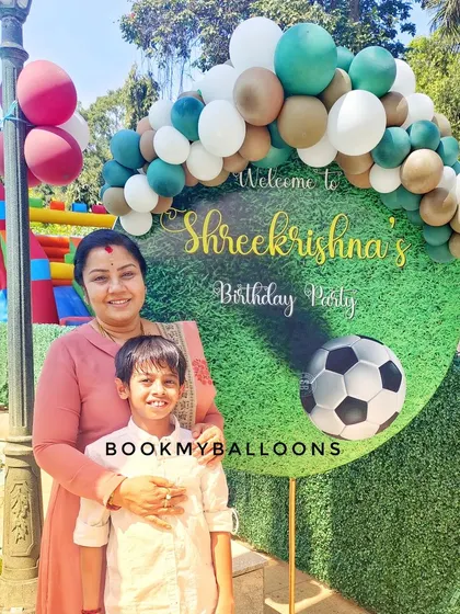 We scored a goal with this football theme for Shreekrishna's birthday. The outdoor setup featured a welcome sign with a turf texture and a soccer ball, framed by a classic balloon garland, perfect for a young sports fan.