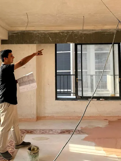 **People of Compartment S4: Kishan Shah:** Kishan on a site visit, demonstrating his hands-on involvement in translating design from paper to reality. He also leads our studio's outreach and public presence.