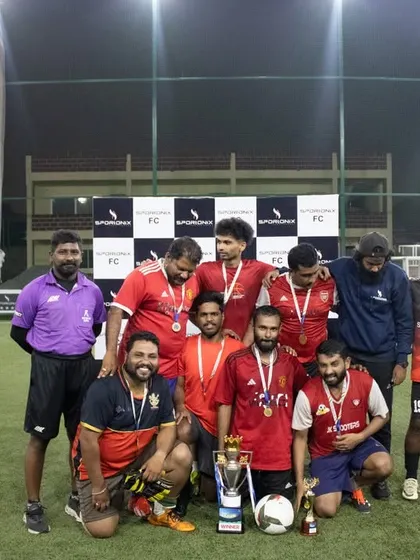 The runners-up team proudly displaying their medals and trophy. Our professional setup makes for great photo opportunities.
