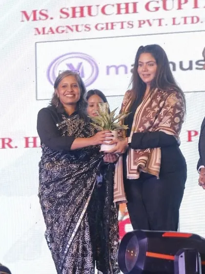 Our director presents a token of appreciation to a guest of honor at the Memorabilia event.